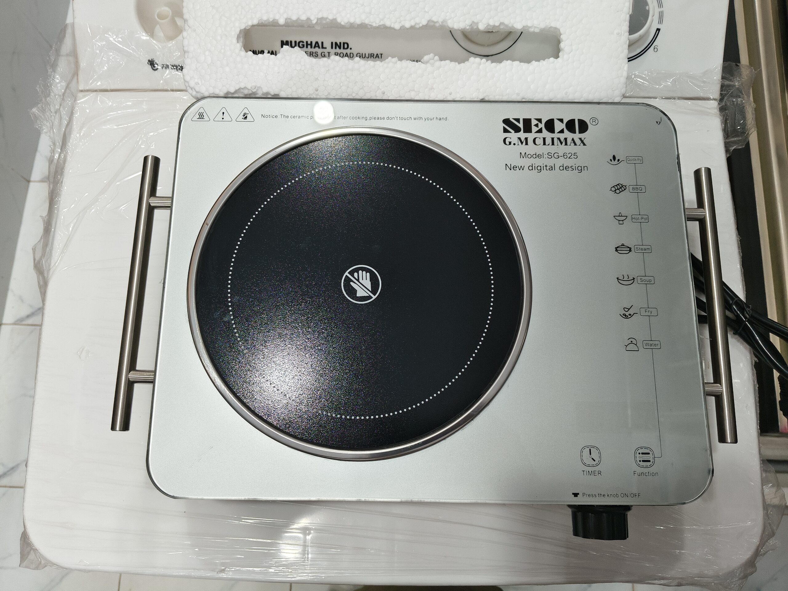 A sleek SECO Electric Hot Plate with a stainless steel body and double infrared burners on a white background.